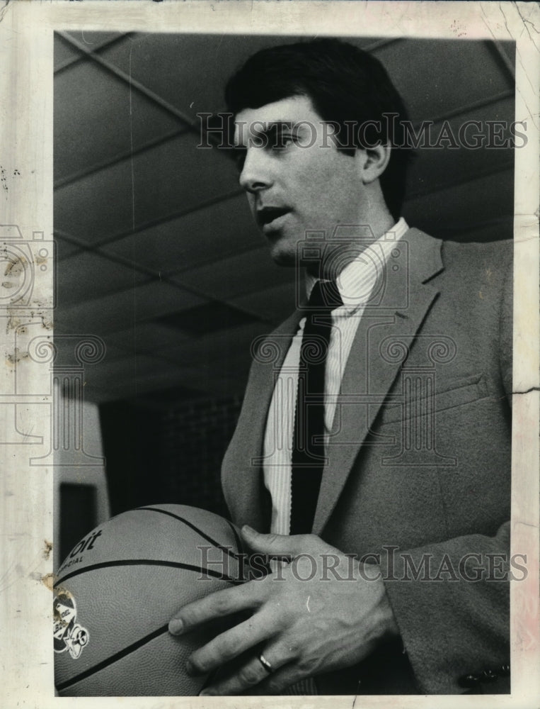 Press Photo Basketball coach John Griffin holds basketball - tus04199- Historic Images