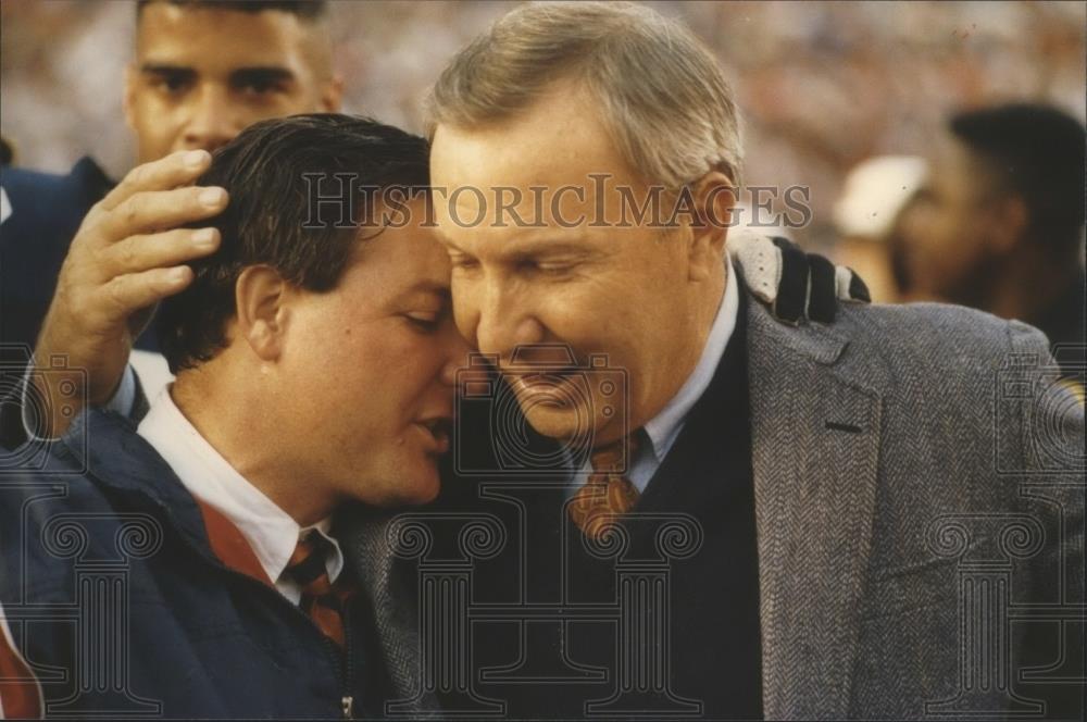 Press Photo Terry Bowden is hugged by another. - abns01752 - Historic Images