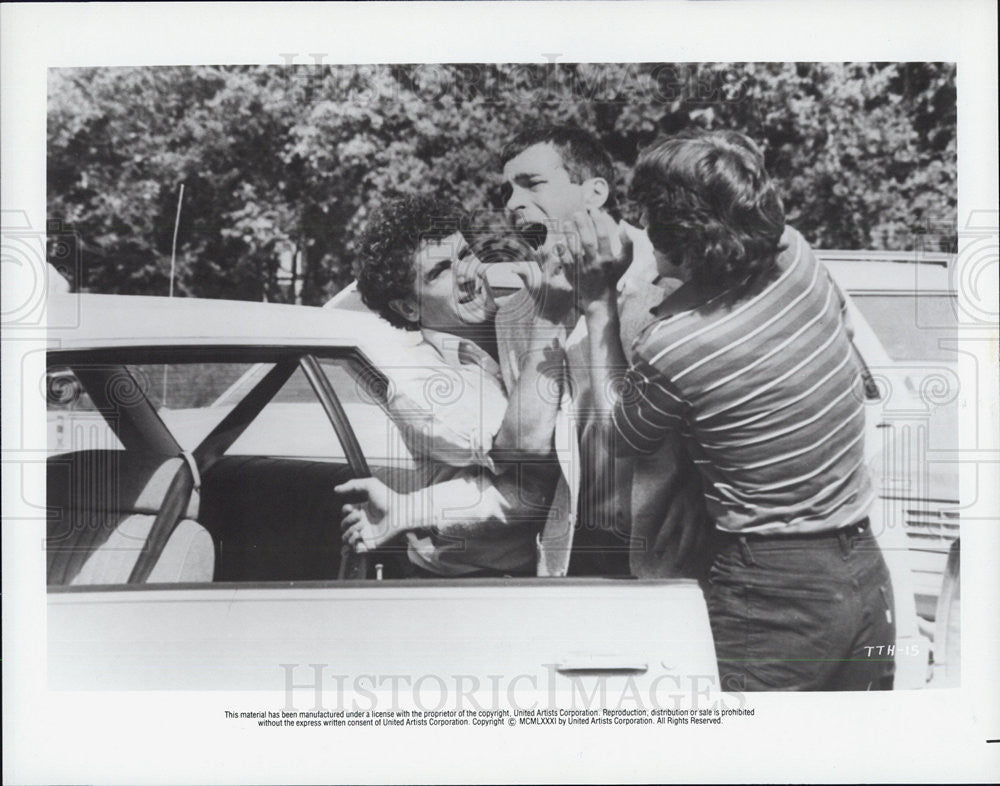 Press Photo unmarked movie with 2 guys grabbing another guy - Historic Images