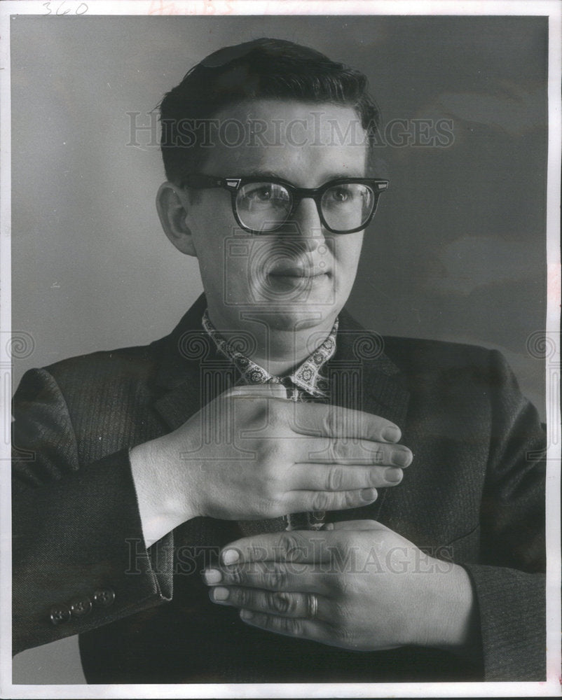 1961 Press Photo Bogan Demonstrating Sign Language Word Curtain - Historic Images