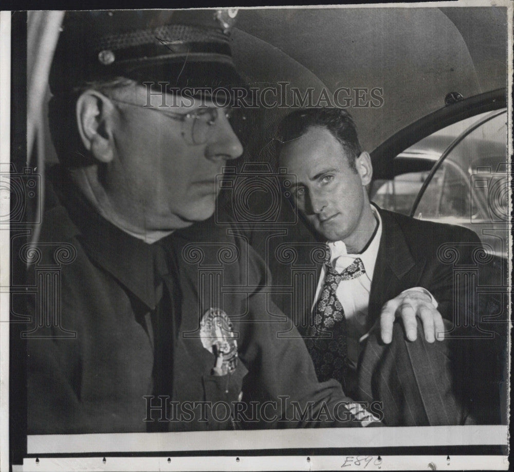 1950 Press Photo John Grant in custody after attempting to blow plane up with - Historic Images