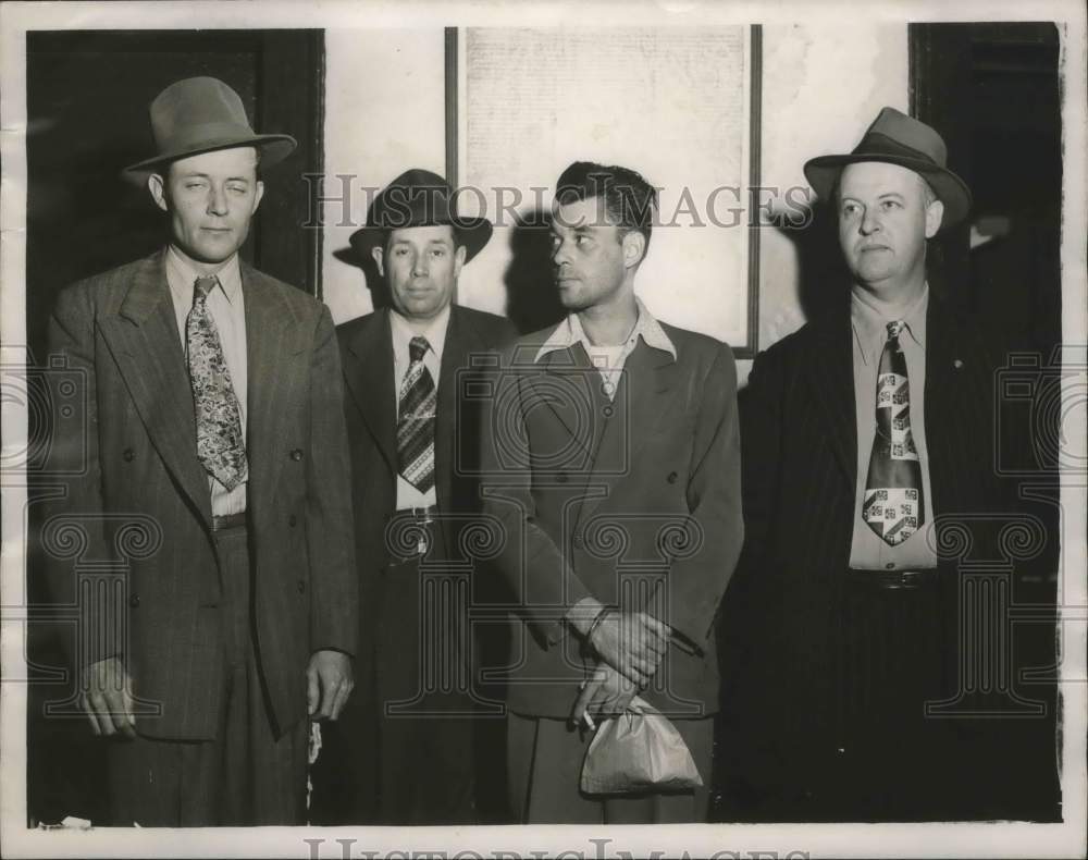 1950, James Lee McGraw, holding bag, and three other men - abna37789 - Historic Images
