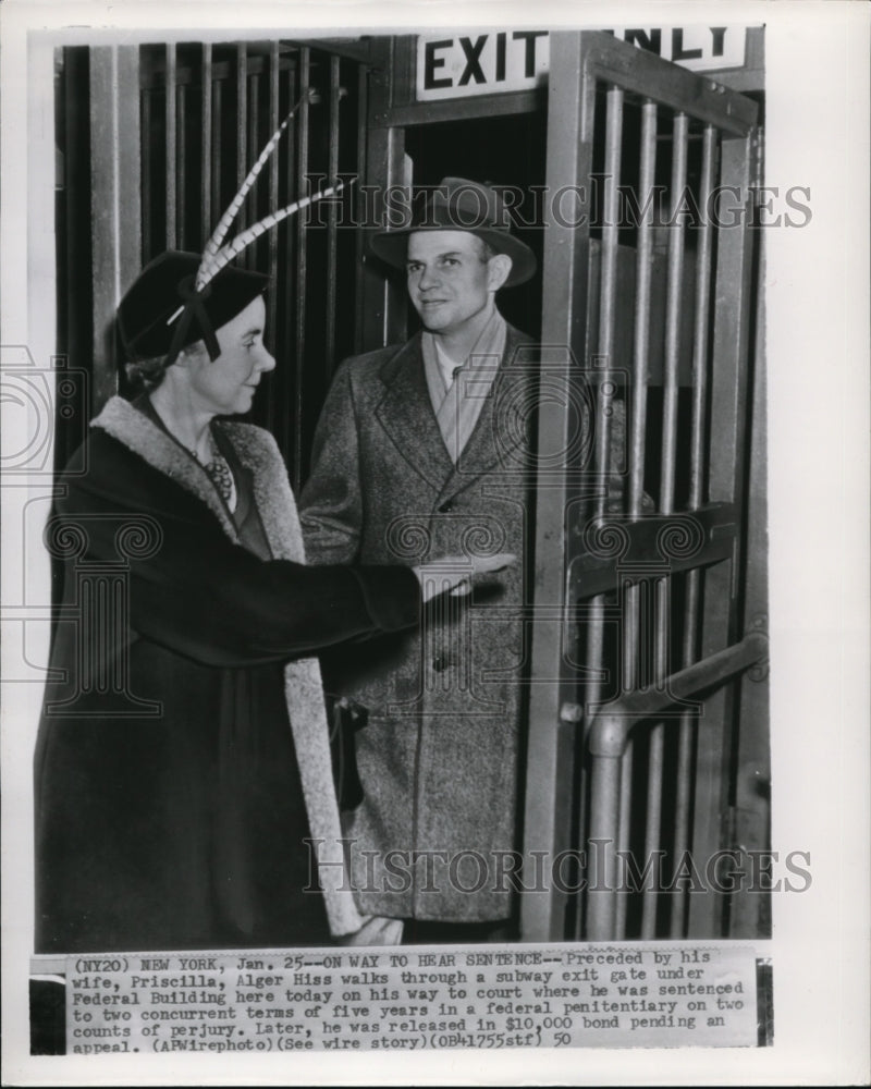 1950 Press Photo Alger Hiss and wife walked through subway exit in New York. - Historic Images