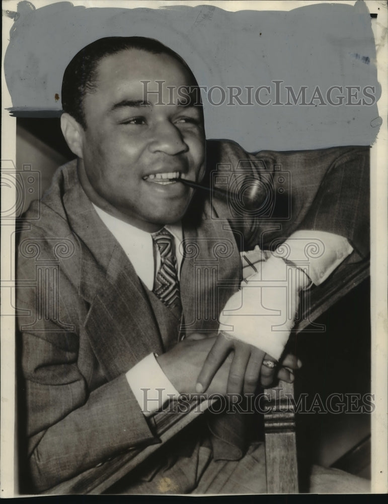 1939 pictured is boxer Henry Armstrong who hurt his hand in a fight - Historic Images