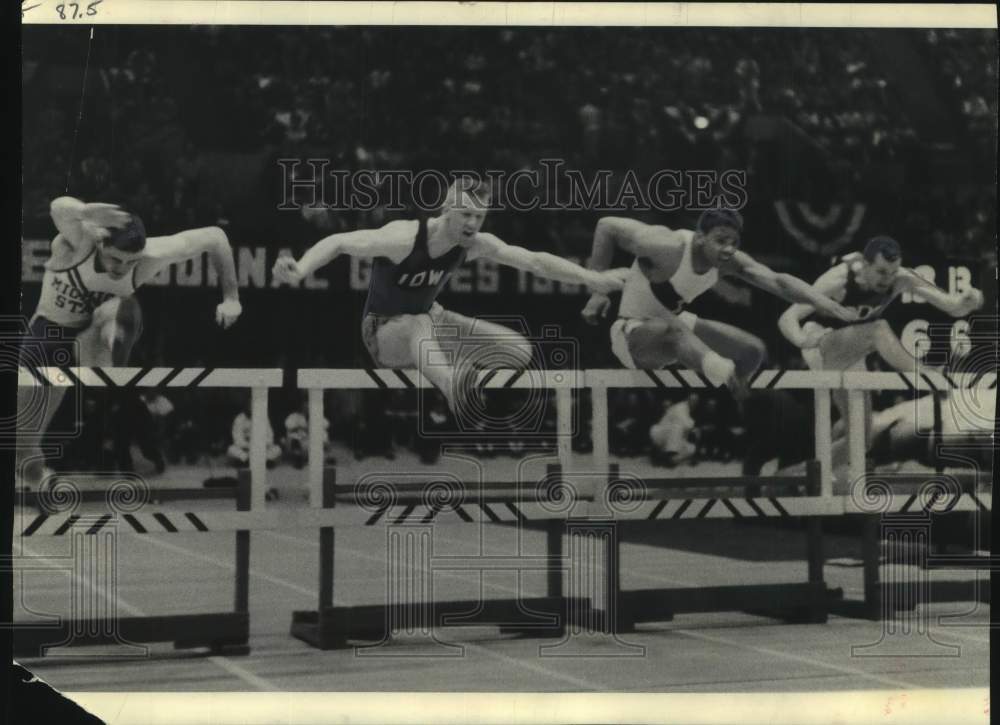 1956 University athletes run 50 yard high hurdles in Milwaukee-Historic Images