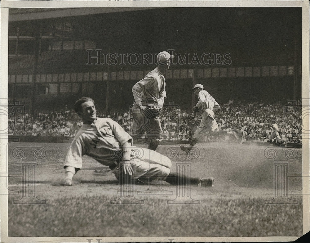 1933 Press Photo Man called out while sliding into third base. - Historic Images