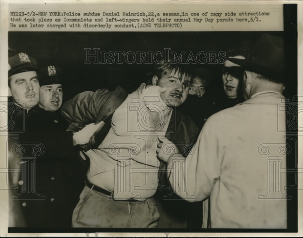 1950 Press Photo Daniel Heinrich subdue by police at the Annual May Day Parade-Historic Images