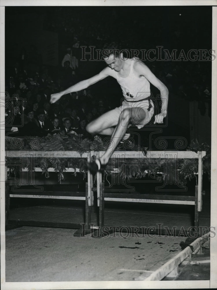 1935 Press Photo Joseph McCluskey clears a hurdle in the 3000m steeplechase - Historic Images