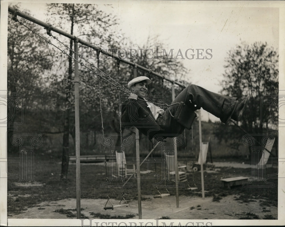 1934 Press Photo Boxer Barney Ross on a swing set at a training camp - nes48950 - Historic Images