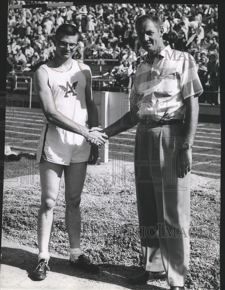 1958 Press Photo Track and field's Henry Wyboney shakes hand of companion - Historic Images