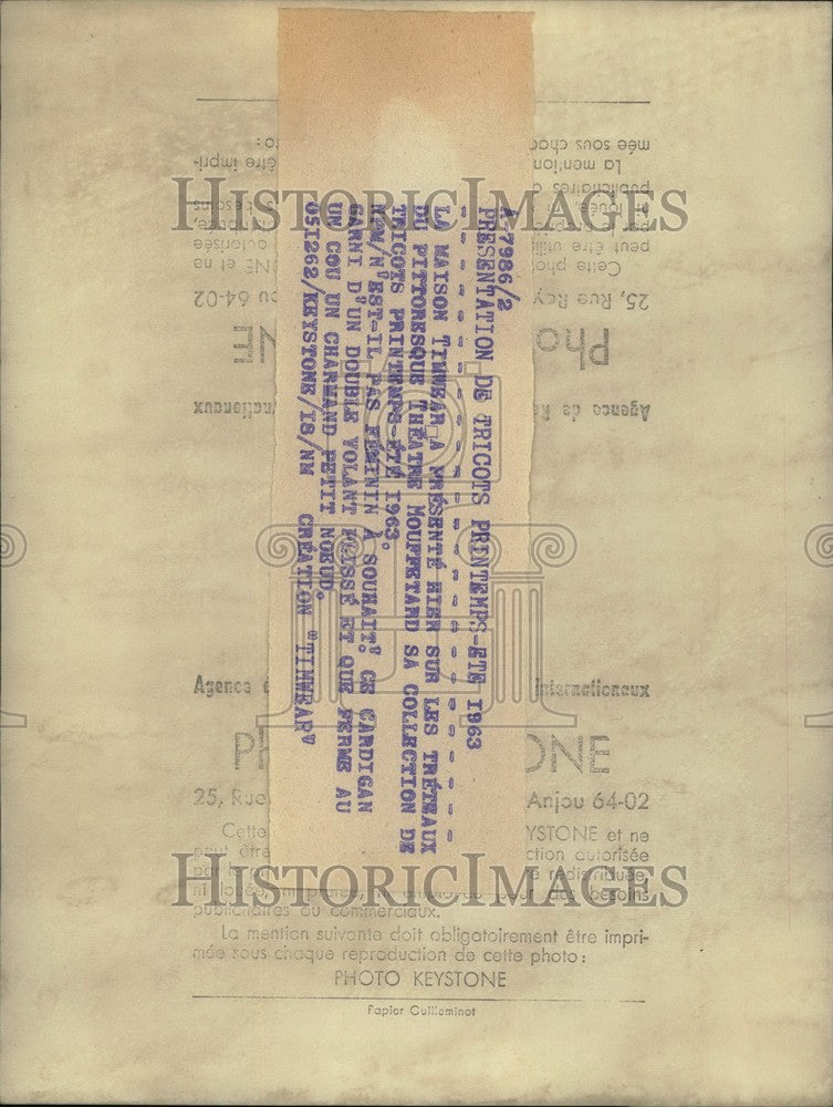 1962 Press Photo Model Wearing Timwear Knit Ruffled Sweater Pours Water Glass