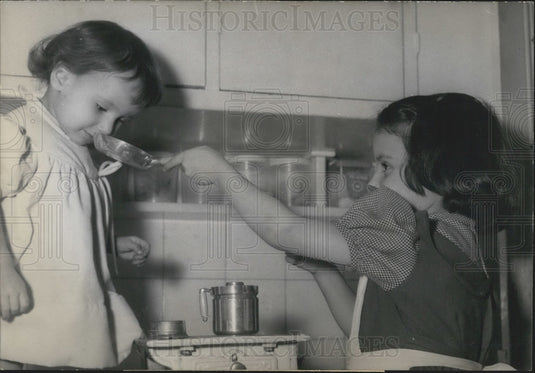 1957 Press Photo Little Girls Playing in a Toy Kitchen