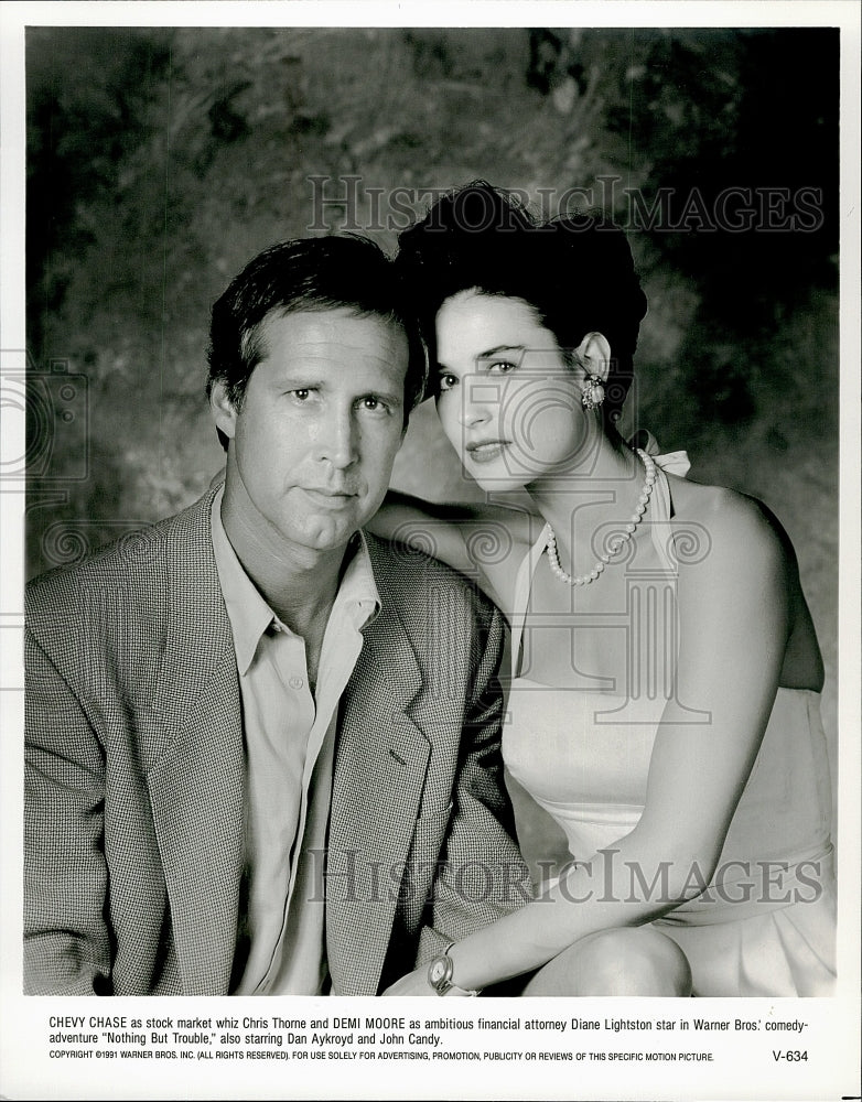 1991 Press Photo Chevy Chase &amp; Demi Moore star in &quot;Nothing But Trouble&quot; - Historic Images