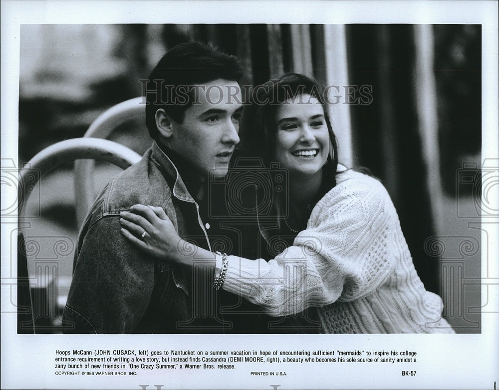 1986 Press Photo John Cusack and Demi Moore in &quot;One Crazy Summer&quot;- Historic Images