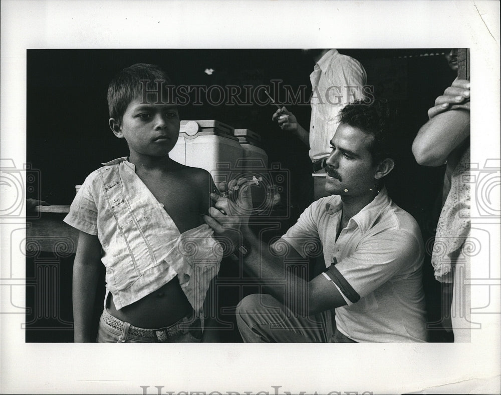 1984 Press Photo Child Receiving Shot on &quot;Living at Risk&quot;- Historic Images