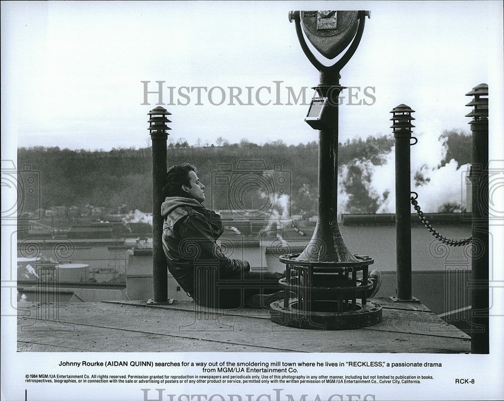 1984 Press Photo Reckless Film Actor Aidan Quinn Overlooking Town Scene- Historic Images