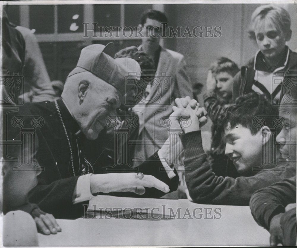 1961 Press Photo Cardinal Cushing Arm Wrestles Boy - RRV50087- Historic Images