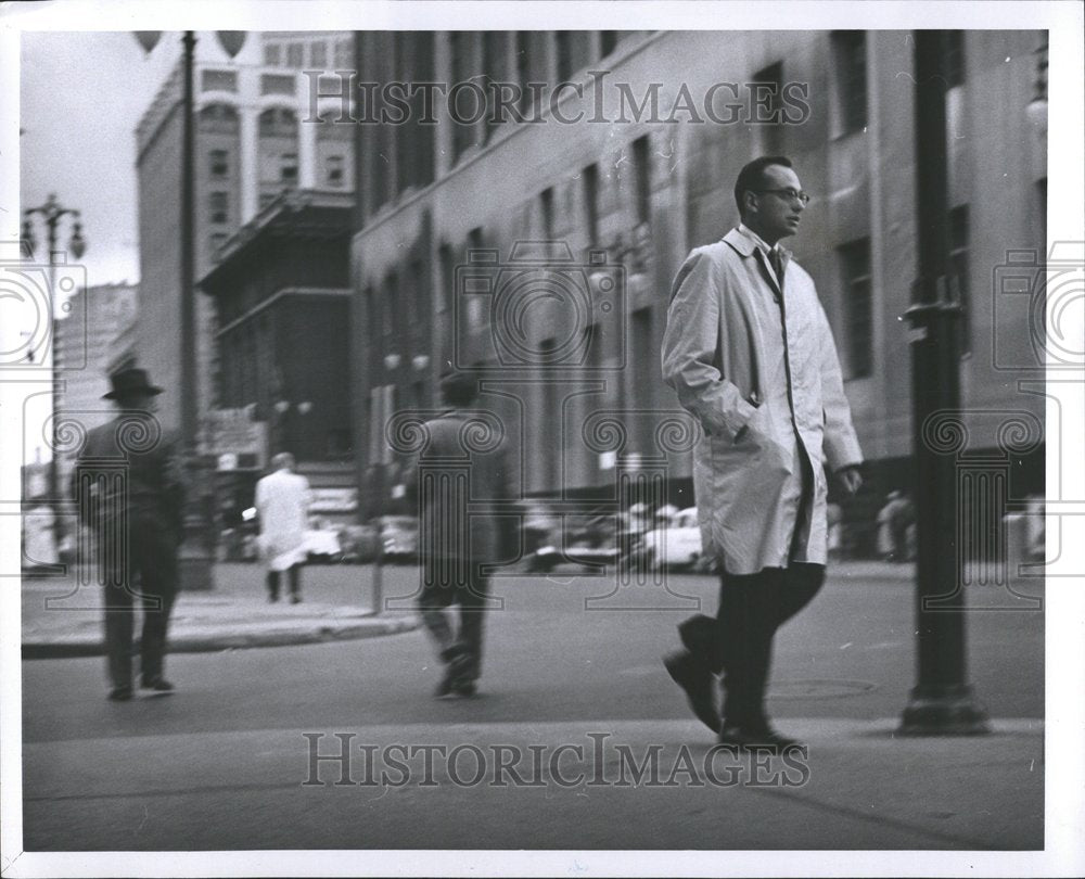 1957 Press Photo Business Coat Man Hand Pocket Street - RRV53823- Historic Images