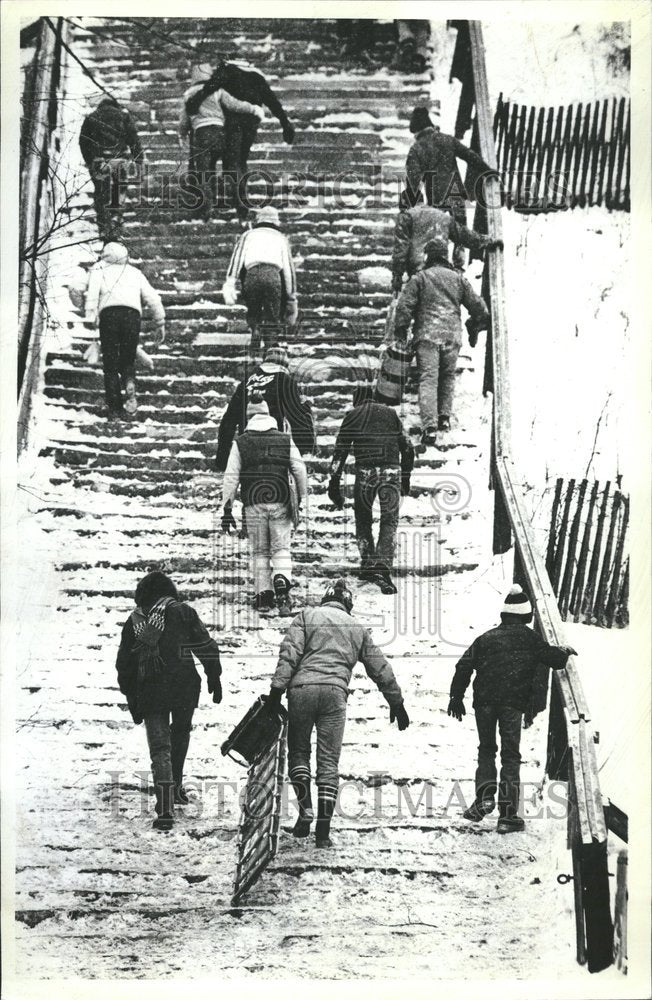 1982 Press Photo Tobogganing thrills climb back up hill - RRV68811- Historic Images