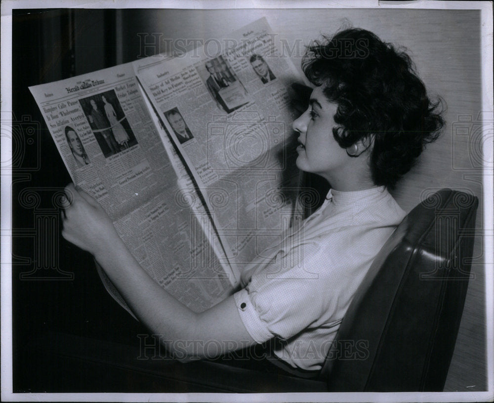 1956 Press Photo Teenager Reads Herald Tribune - RRX02815- Historic Images