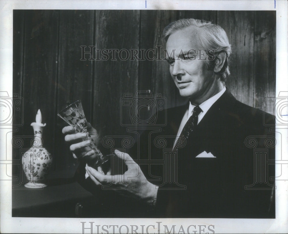 1971 Press Photo Micheal Examines Antique sherry glass Wine Museum Harvey- Historic Images