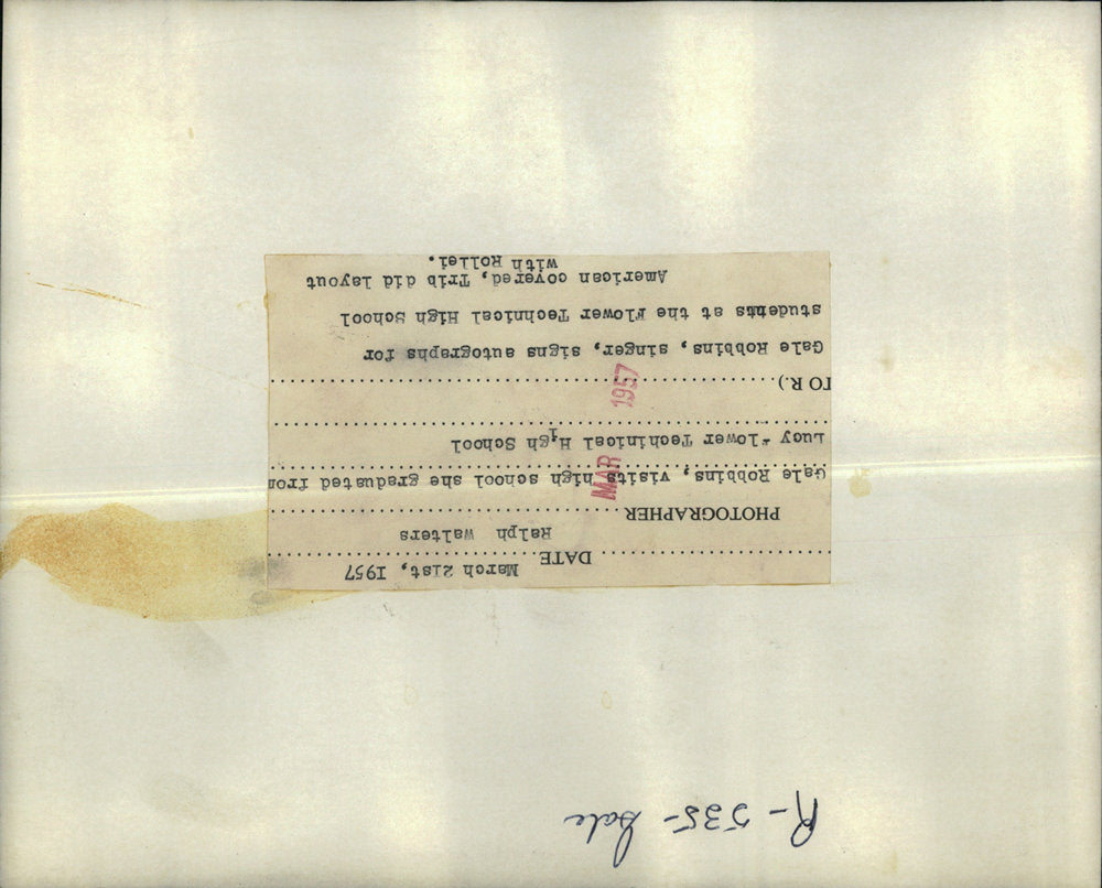 1957 Press Photo Gale Robbins singer signs autographs students High School