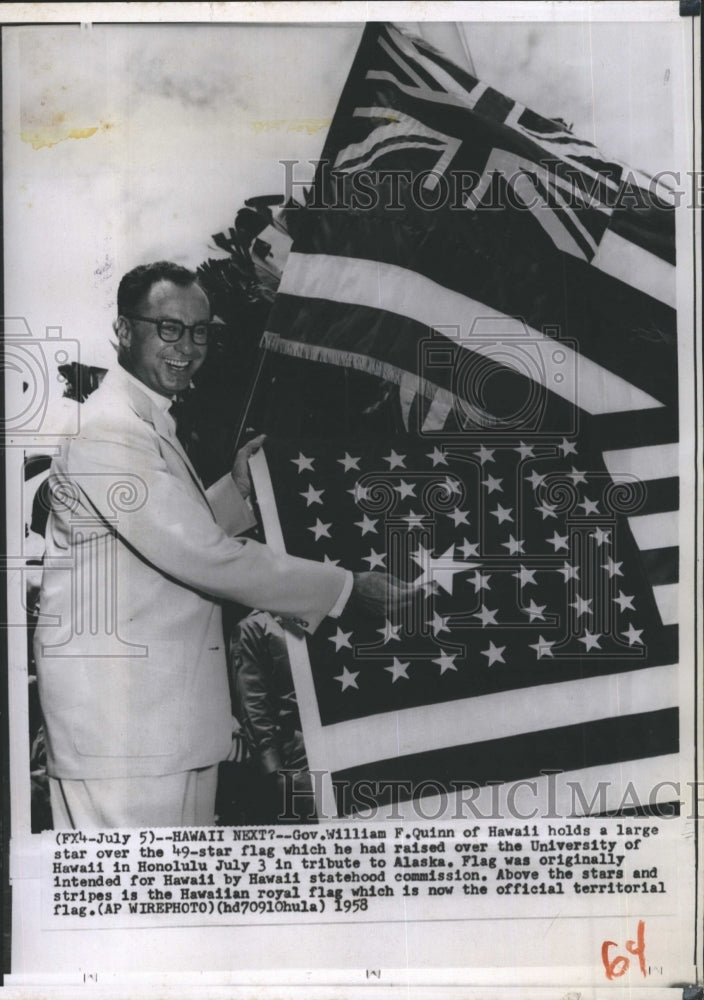 1958 Press Photo Gov. William F. Quinn, holds large flat. - RSH47735