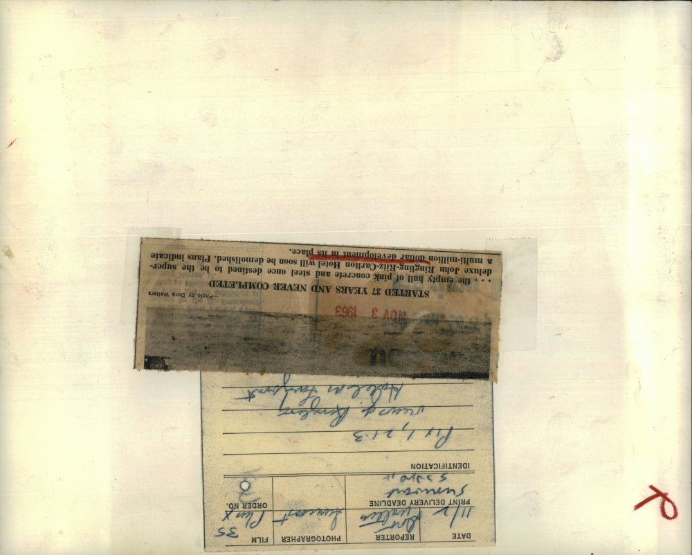 1963 Press Photo Pink Concrete Building Deluxe Hotel Started 37 Yrs. Ago Empty