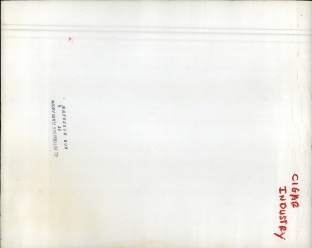 Press Photo Rolling Cigar. - RSJ01579