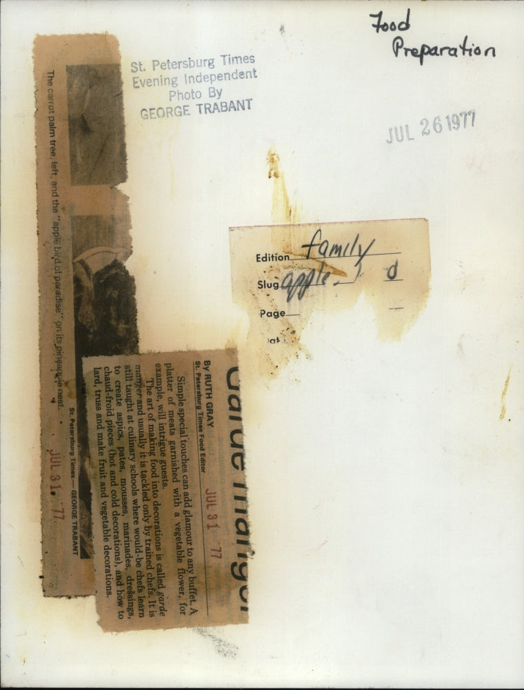 1977PressPhoto The carrot palm tree(L) & apple bird of paradise on its pineapple