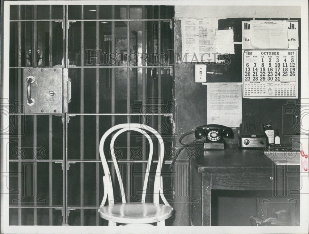 1957 Press Photo 16-year-old girl placed behind this bars - RSJ14423