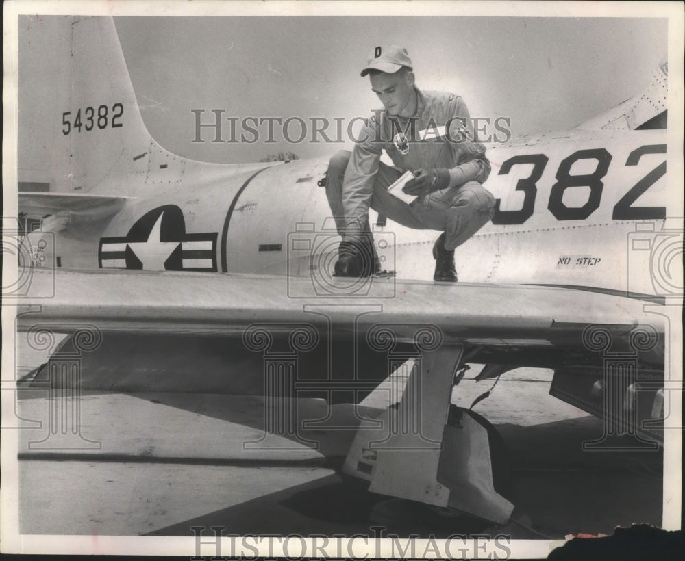 1967 Press Photo flight crew member checking plane, Craig Air Field, Selma, AL- Historic Images