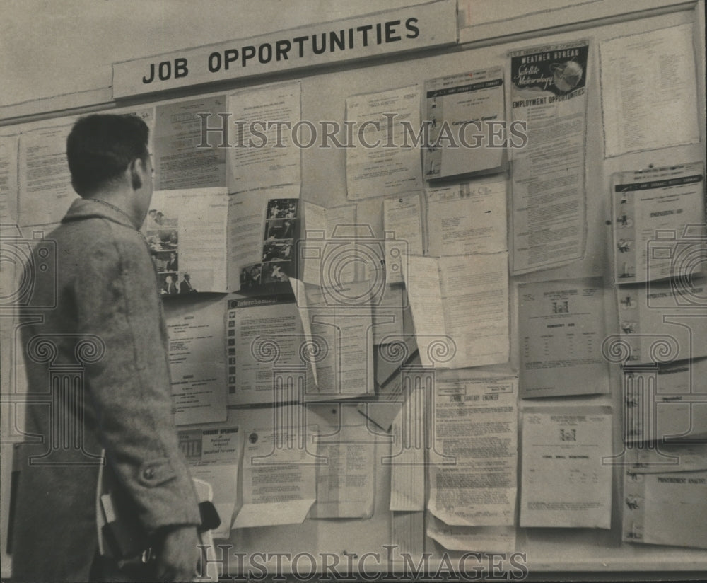 1960 Press Photo Engineering student reviews job posts, University of Alabama- Historic Images