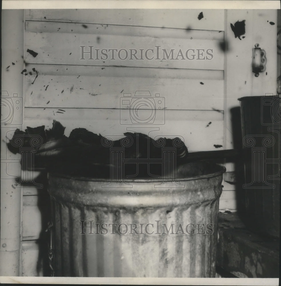 1955 Press Photo Papers and a mop placed in this garbage can, Arson Evidence