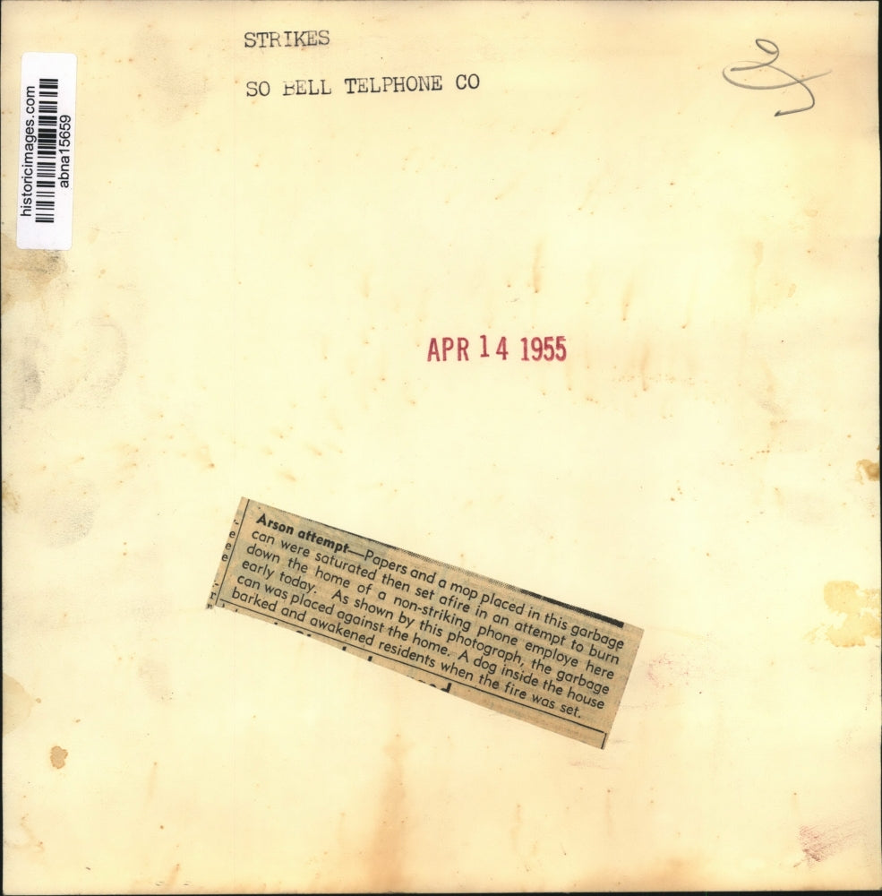 1955 Press Photo Papers and a mop placed in this garbage can, Arson Evidence