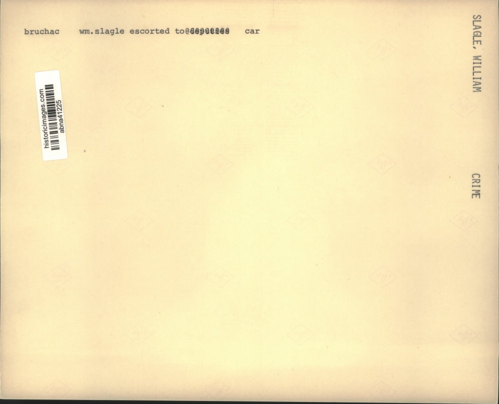 Press Photo William Slagle escorted to car by police officer - abna41225