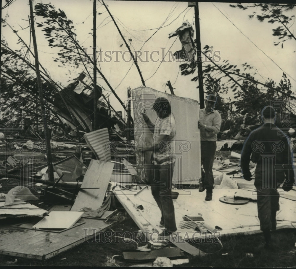 1972 Press Photo Volunteers salvage mattress in tornado debris in Alabama