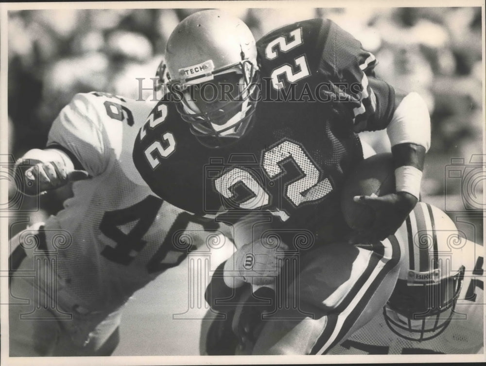 1987 Press Photo Georgia Tech Runner Has Football As Auburn Tries To Stop Him - Historic Images