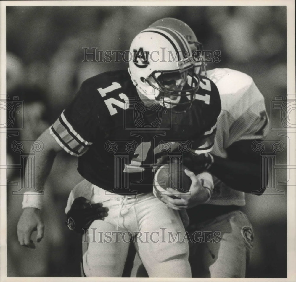 1987 Press Photo Auburn Player Burger Takes Sack With Football By Florida State - Historic Images