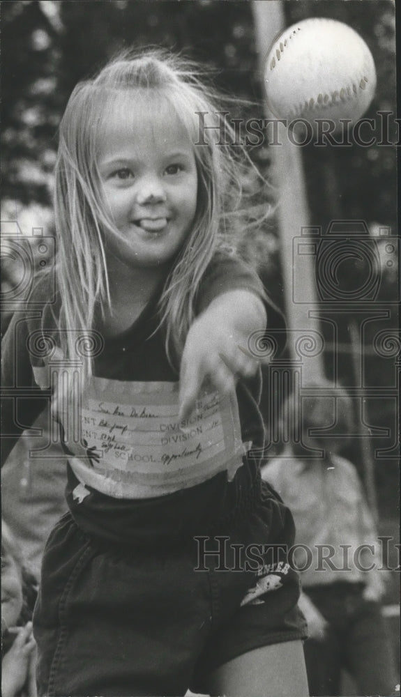 1973 Press Photo Little Sue Ann Throws Baseball During Special Olympics Event - Historic Images