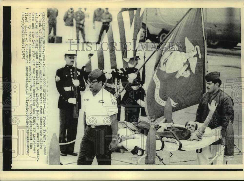 1973 Press Photo Wounded POW Waves From Stretcher As He Returns After Release- Historic Images