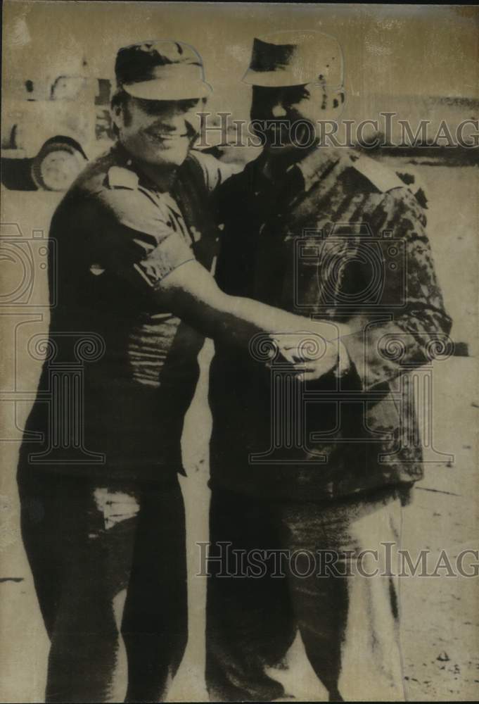 Load image into Gallery viewer, Press Photo Captain Nafatali Shimrad and Colonel Yousef Mekki hug at Checkpoint

