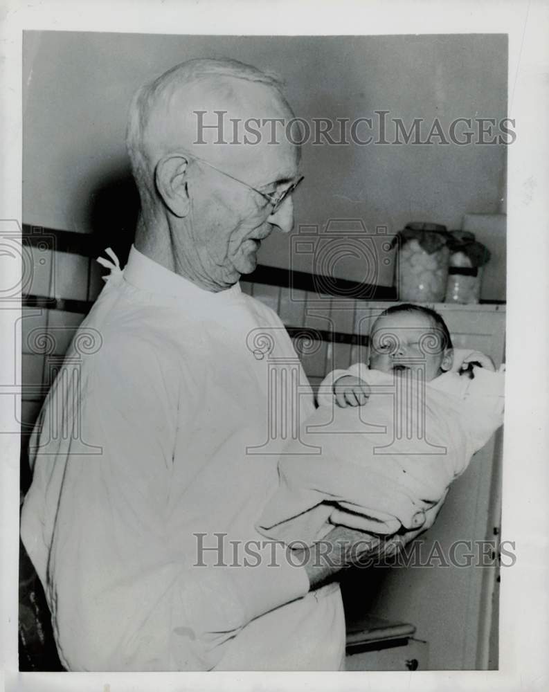 1953 Press Photo William J. Springhorn holds Joseph Nanouski, Jr. in Ottawa, Ill - Historic Images