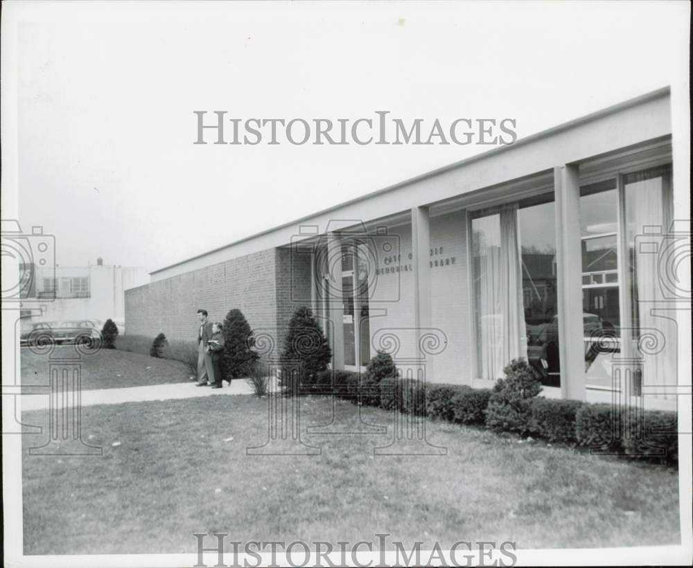 1957 Press Photo Patrons leave East Detroit, Michigan library on Oak Street - Historic Images