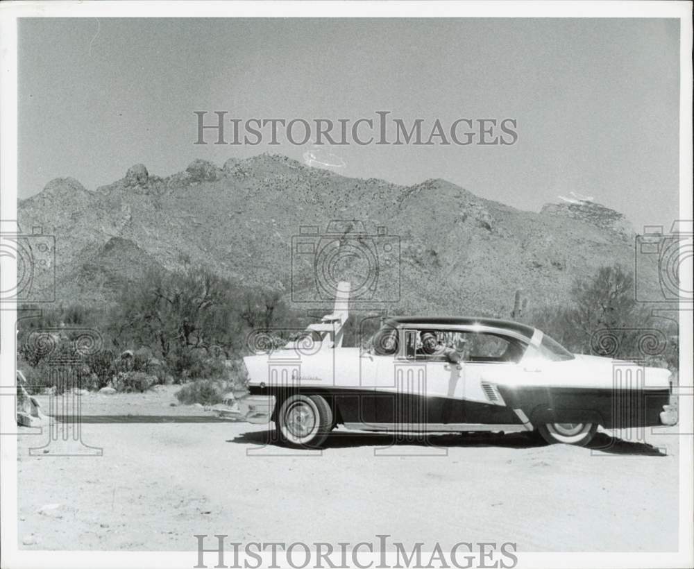 1956 Press Photo Albert E. Cobo drives a car in his Arizona property - afa39615 - Historic Images