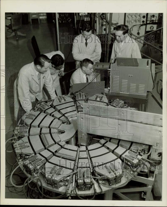 1957 Press Photo Scientists work with a model of the "Synchrocrash" - afx21056 - Historic Images