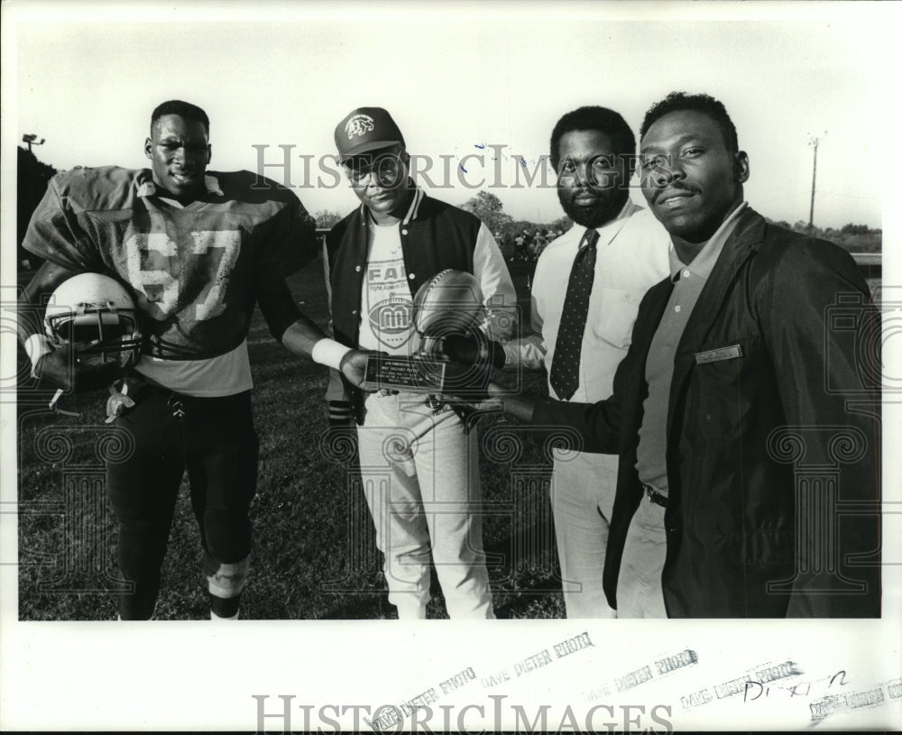 Press Photo Ray Greene With Football Players Holding Trophy On Field - ahta01589 - Historic Images