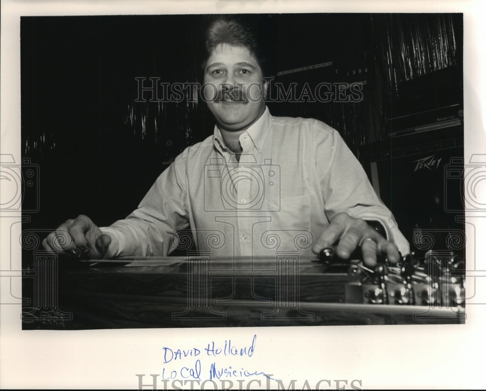 1988 Press Photo Local Musician David Holland Plays Instrument - ahta01610 - Historic Images