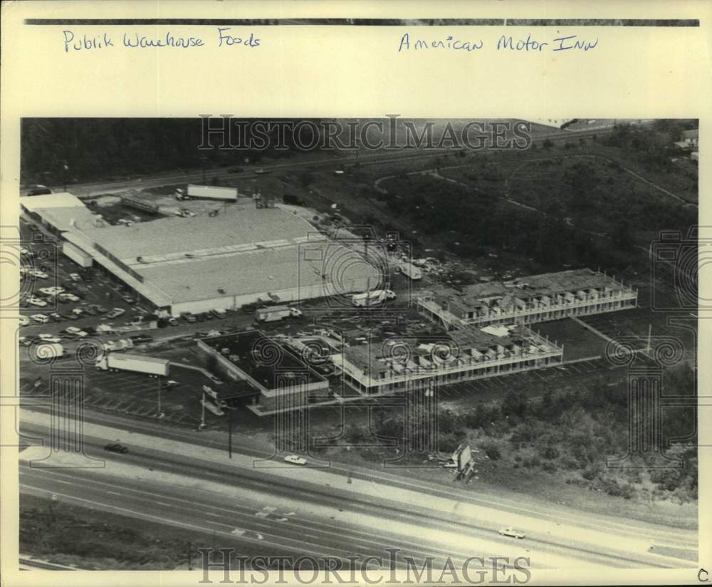 1985 Press Photo Publik Warehouse Foods, American Motor Inn Hurricane Damage- Historic Images