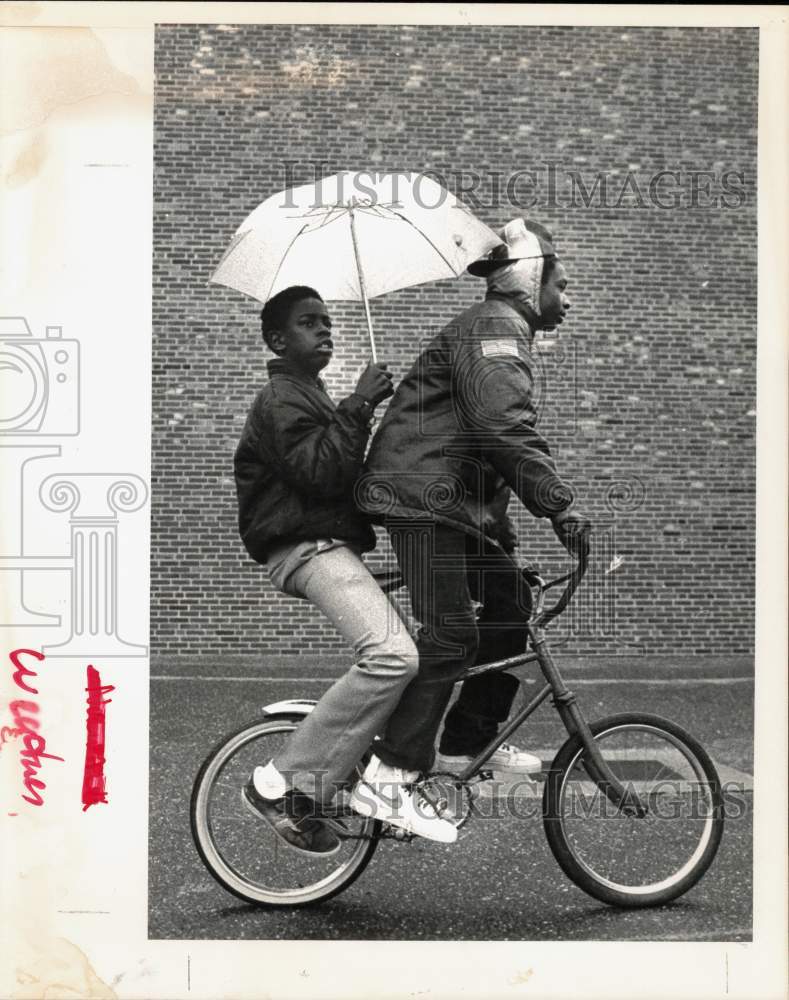 1983 Press Photo William Witherspoon gives Bicycle Ride to Anthony Snider- Historic Images